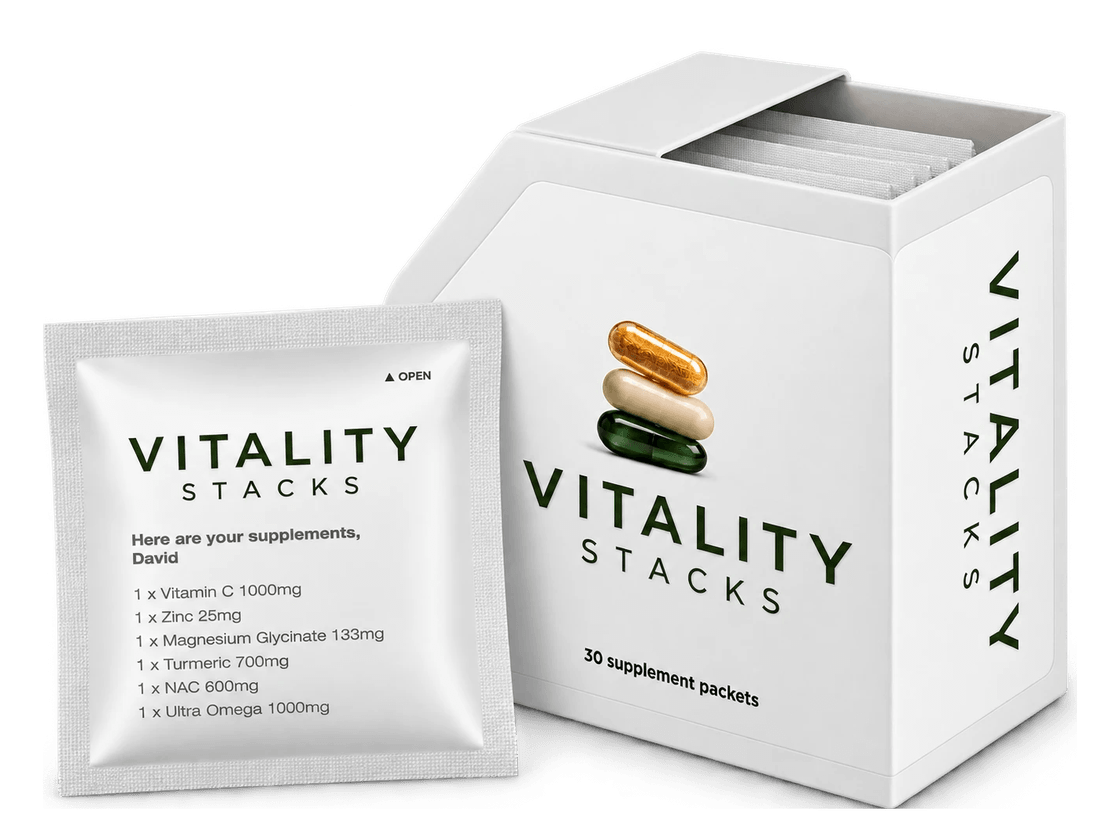 The daily pack box with one sachet in front of it, printed with an example day of supplements